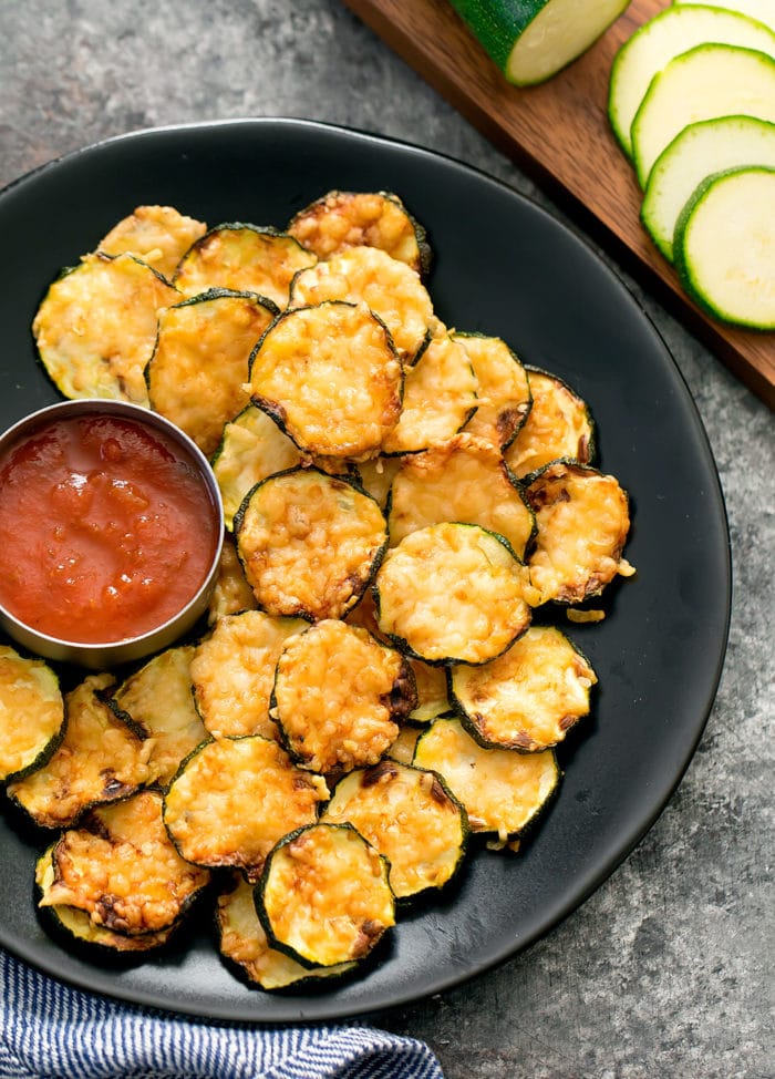 keto air fryer zucchini crisps served with sauce