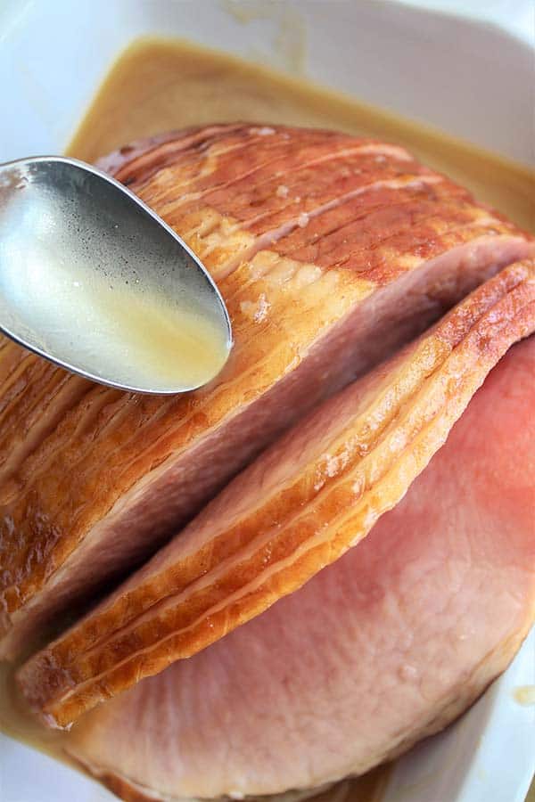 glazing the ham with juice