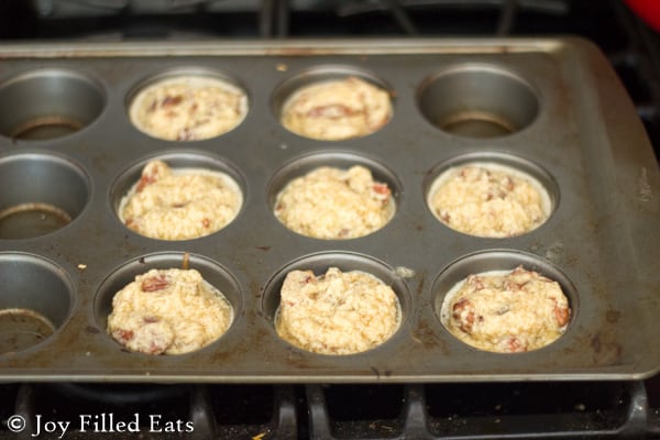 pecan pie tarts mixture in muffin tin