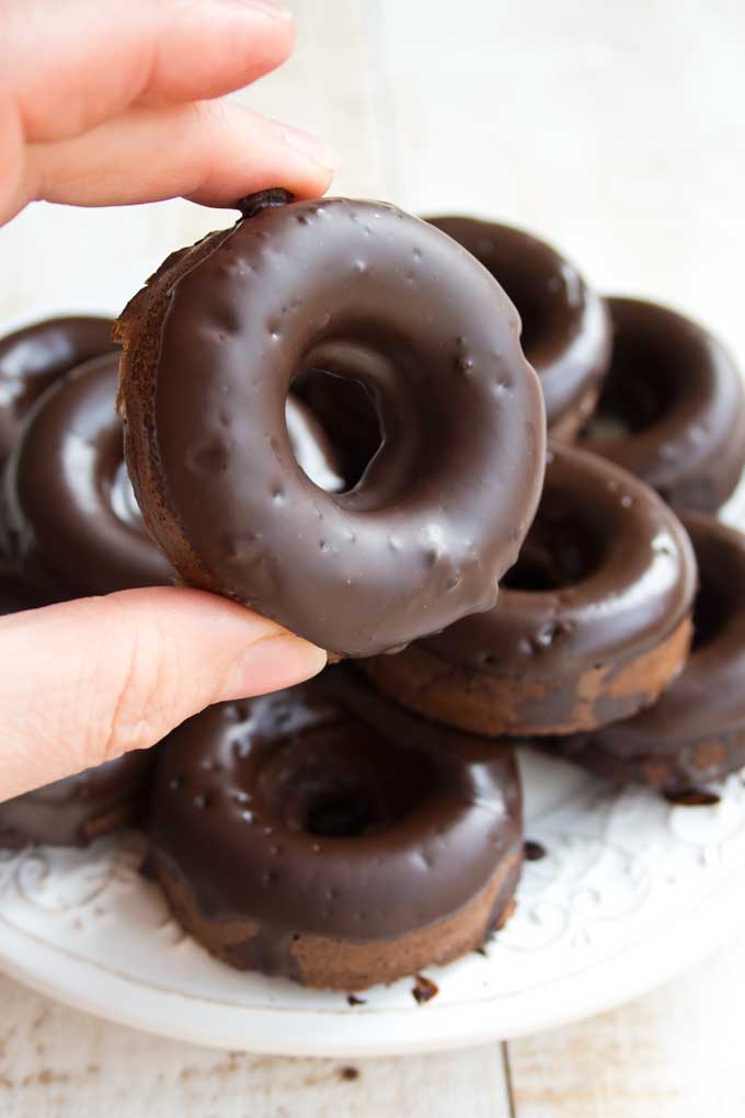 keto chocolate donuts in palm of hand